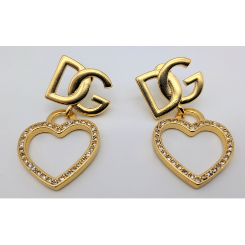 111 - A Dolce & Gabbana Logo and Hearts Necklace and Earrings Set. From the Italian Tailoring Collection. ... 