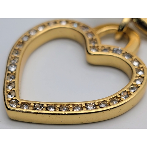 111 - A Dolce & Gabbana Logo and Hearts Necklace and Earrings Set. From the Italian Tailoring Collection. ... 