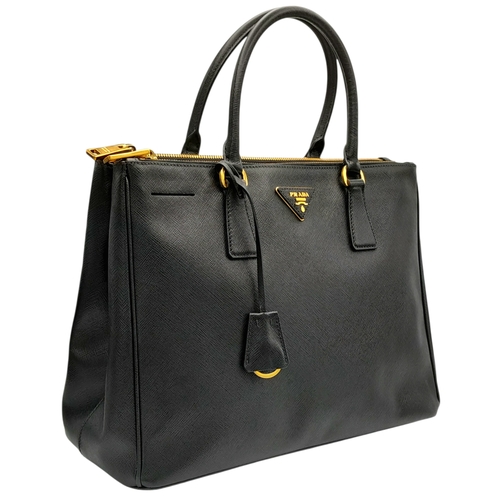 113 - A Prada Saffiano Galleria Double Zip Tote Bag. Black Saffiano cross-grain leather exterior with gold... 