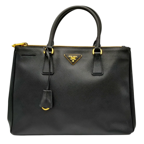 113 - A Prada Saffiano Galleria Double Zip Tote Bag. Black Saffiano cross-grain leather exterior with gold... 