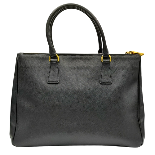 113 - A Prada Saffiano Galleria Double Zip Tote Bag. Black Saffiano cross-grain leather exterior with gold... 