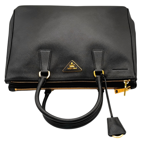 113 - A Prada Saffiano Galleria Double Zip Tote Bag. Black Saffiano cross-grain leather exterior with gold... 