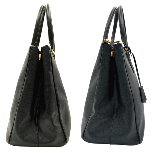 113 - A Prada Saffiano Galleria Double Zip Tote Bag. Black Saffiano cross-grain leather exterior with gold... 