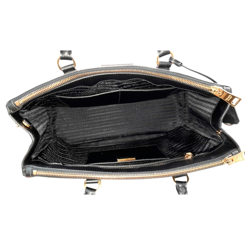 113 - A Prada Saffiano Galleria Double Zip Tote Bag. Black Saffiano cross-grain leather exterior with gold... 