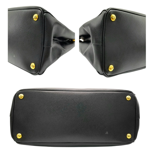 113 - A Prada Saffiano Galleria Double Zip Tote Bag. Black Saffiano cross-grain leather exterior with gold... 