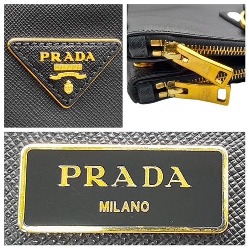 113 - A Prada Saffiano Galleria Double Zip Tote Bag. Black Saffiano cross-grain leather exterior with gold... 