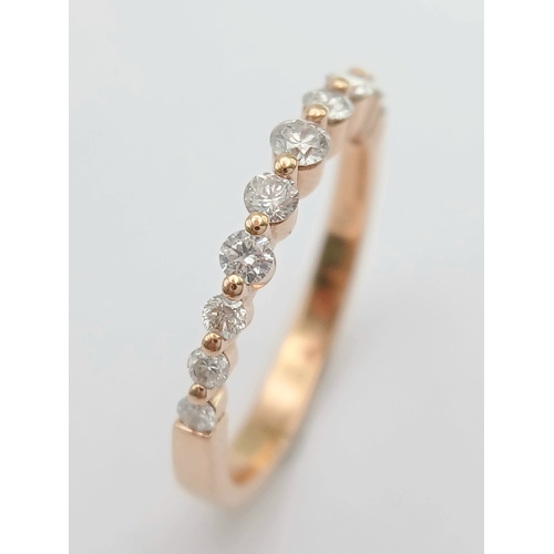 187 - AN 18K ROSE GOLD, DIAMOND SET, HALF ETERNITY RING. 0.41 CTW. 2.6G, SIZE N. SPSA 1019