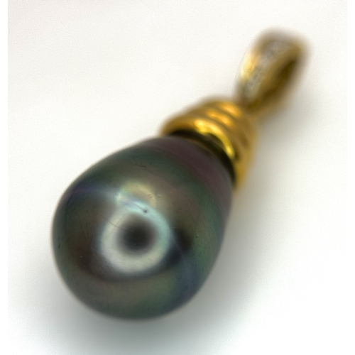 191 - An 18K Yellow Gold and Diamond Pendant with Tahitian Pearl. 2.5cm. 4.25g total weight.