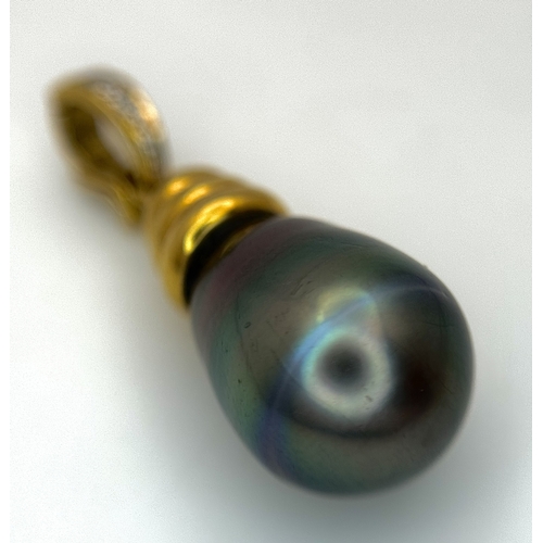 191 - An 18K Yellow Gold and Diamond Pendant with Tahitian Pearl. 2.5cm. 4.25g total weight.