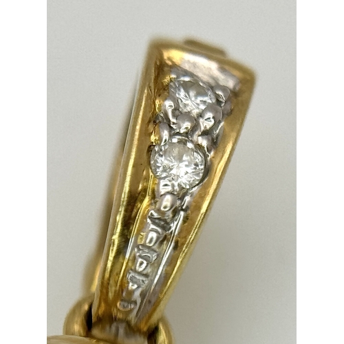 191 - An 18K Yellow Gold and Diamond Pendant with Tahitian Pearl. 2.5cm. 4.25g total weight.