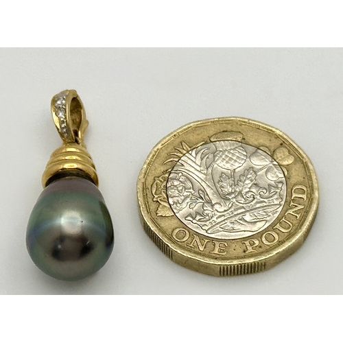 191 - An 18K Yellow Gold and Diamond Pendant with Tahitian Pearl. 2.5cm. 4.25g total weight.
