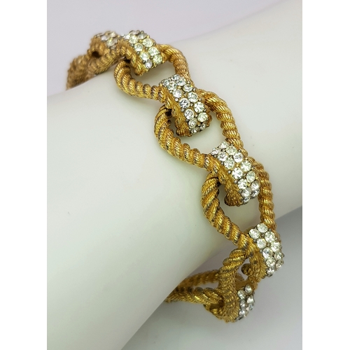 195 - A Vintage 1950s Ciner 18K Gold Plated White Stone Set Bracelet. Complete with safety chain. 19cm len... 