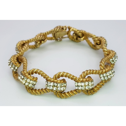 195 - A Vintage 1950s Ciner 18K Gold Plated White Stone Set Bracelet. Complete with safety chain. 19cm len... 