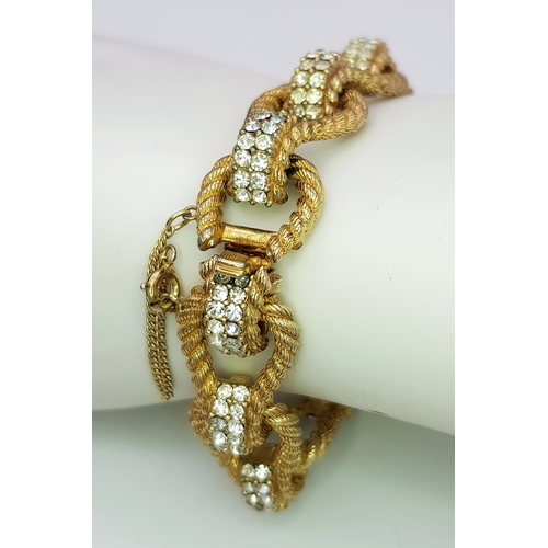 195 - A Vintage 1950s Ciner 18K Gold Plated White Stone Set Bracelet. Complete with safety chain. 19cm len... 