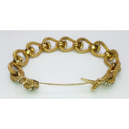 195 - A Vintage 1950s Ciner 18K Gold Plated White Stone Set Bracelet. Complete with safety chain. 19cm len... 
