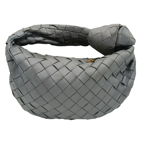 197 - A Bottega Veneta Intrecciato Mini Jodie Handbag. Woven grey/blue leather exterior with gold-toned ha... 