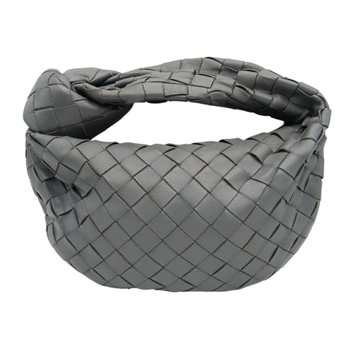 197 - A Bottega Veneta Intrecciato Mini Jodie Handbag. Woven grey/blue leather exterior with gold-toned ha... 