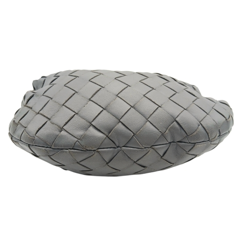 197 - A Bottega Veneta Intrecciato Mini Jodie Handbag. Woven grey/blue leather exterior with gold-toned ha... 