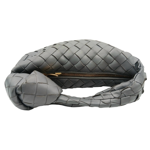 197 - A Bottega Veneta Intrecciato Mini Jodie Handbag. Woven grey/blue leather exterior with gold-toned ha... 
