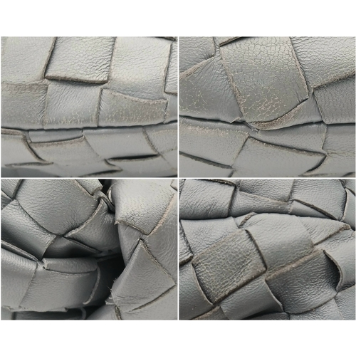 197 - A Bottega Veneta Intrecciato Mini Jodie Handbag. Woven grey/blue leather exterior with gold-toned ha... 