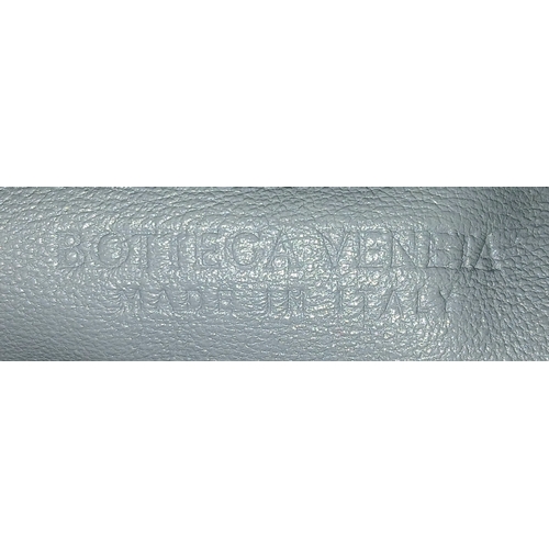 197 - A Bottega Veneta Intrecciato Mini Jodie Handbag. Woven grey/blue leather exterior with gold-toned ha... 