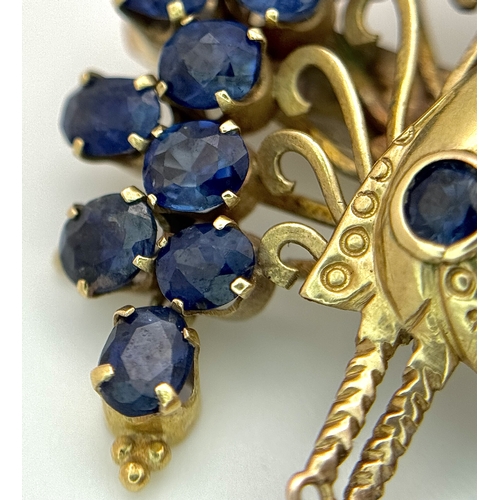 198 - A 14K Yellow Gold Sapphire Peacock Brooch. White metal backing. One stone missing. 30mm x 34mm. 5.19... 