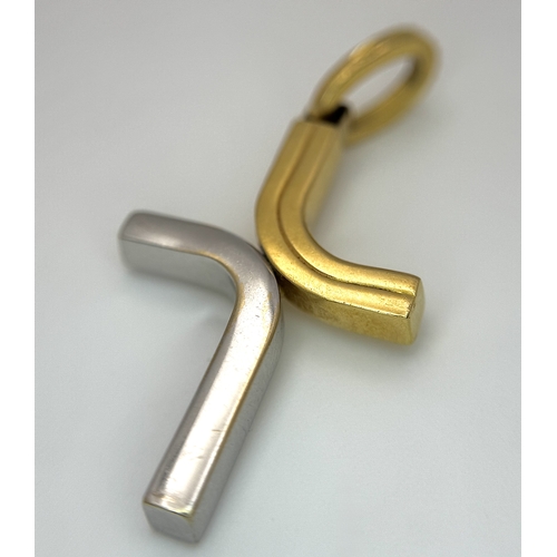 209 - An 18K Yellow and White Gold Abstract Cross Pendant. 4.5cm. 3.9g. MT72.