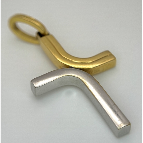 209 - An 18K Yellow and White Gold Abstract Cross Pendant. 4.5cm. 3.9g. MT72.
