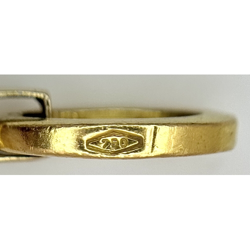 209 - An 18K Yellow and White Gold Abstract Cross Pendant. 4.5cm. 3.9g. MT72.