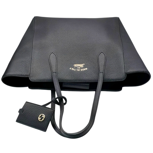 211 - A Gucci Swing Tote Bag. Black grained leather exterior with dual shoulder straps, detachable leather... 