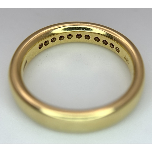 219 - An 18K Yellow Gold and Diamond Half Eternity Ring. Size N. Channel set round brilliant cut diamonds.... 