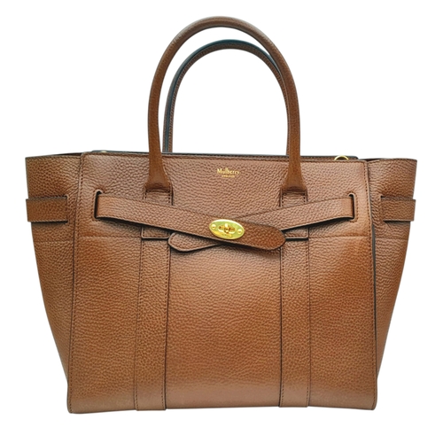 225 - A Mulberry Bayswater Handbag. Oak brown grain leather exterior with gold-toned hardware, dual top ha... 