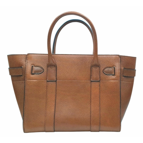 225 - A Mulberry Bayswater Handbag. Oak brown grain leather exterior with gold-toned hardware, dual top ha... 