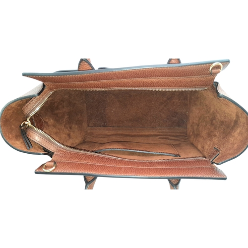 225 - A Mulberry Bayswater Handbag. Oak brown grain leather exterior with gold-toned hardware, dual top ha... 