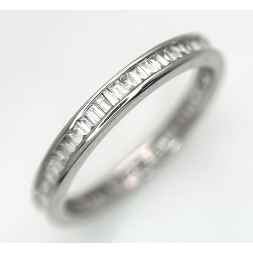 230 - A 9K White Gold Diamond Eternity Ring. 1ctw of baguette channel set diamonds. Size P 1/2. 1/73g. MT7... 