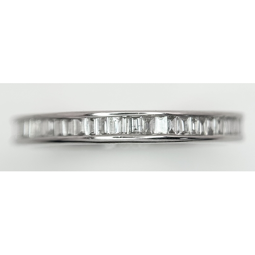 230 - A 9K White Gold Diamond Eternity Ring. 1ctw of baguette channel set diamonds. Size P 1/2. 1/73g. MT7... 