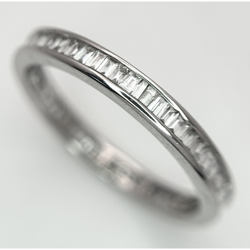 230 - A 9K White Gold Diamond Eternity Ring. 1ctw of baguette channel set diamonds. Size P 1/2. 1/73g. MT7... 