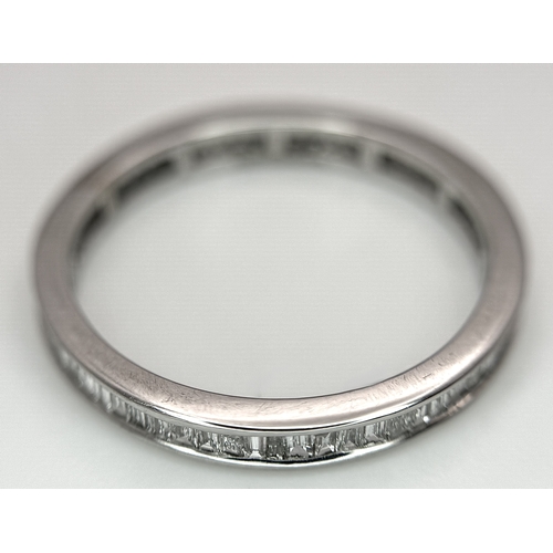 230 - A 9K White Gold Diamond Eternity Ring. 1ctw of baguette channel set diamonds. Size P 1/2. 1/73g. MT7... 