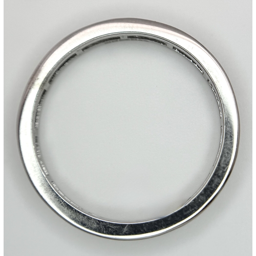 230 - A 9K White Gold Diamond Eternity Ring. 1ctw of baguette channel set diamonds. Size P 1/2. 1/73g. MT7... 