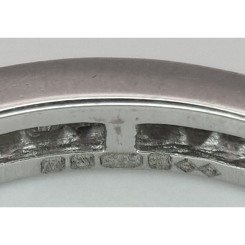230 - A 9K White Gold Diamond Eternity Ring. 1ctw of baguette channel set diamonds. Size P 1/2. 1/73g. MT7... 