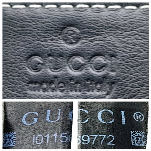 232 - A Gucci Guccissima Sukey Handbag. Black GG monogram embossed leather exterior with silver-tone hardw... 