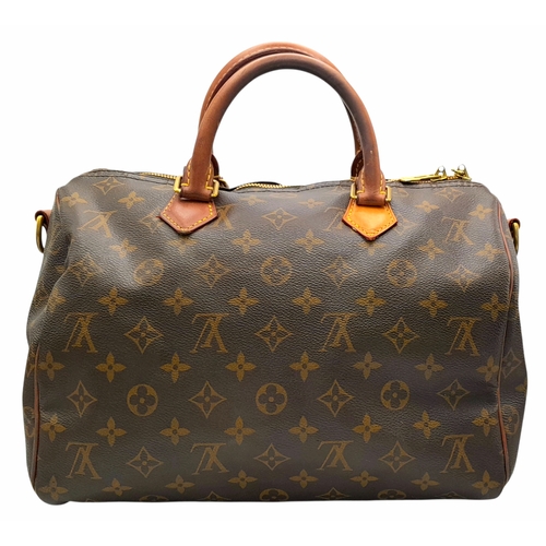 303 - A Louis Vuitton Monogram Speedy 30 Handbag. Signature brown monogram coated canvas exterior with vac... 