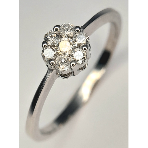 313 - A 9K WHITE GOLD, DIAMOND CLUSTER RING. 0.25 CTW, 1.8G, SIZE Q. SC 7007