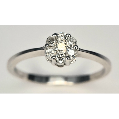 313 - A 9K WHITE GOLD, DIAMOND CLUSTER RING. 0.25 CTW, 1.8G, SIZE Q. SC 7007