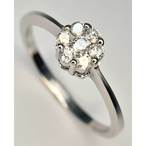 313 - A 9K WHITE GOLD, DIAMOND CLUSTER RING. 0.25 CTW, 1.8G, SIZE Q. SC 7007