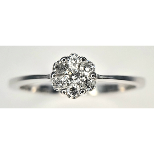 313 - A 9K WHITE GOLD, DIAMOND CLUSTER RING. 0.25 CTW, 1.8G, SIZE Q. SC 7007