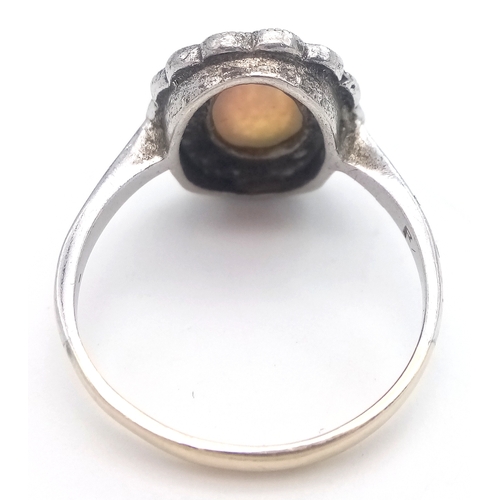 315 - Dainty 9 CARAT GOLD and SILVER RING with lab OPAL CABOCHON to Centre. Size J - J 1/2.