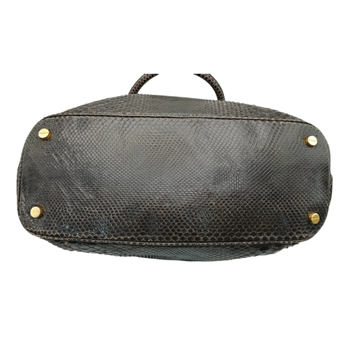 317 - A Tom Ford Python Skin Leather Handbag. Crafted in dark brown genuine python skin with a rich, natur... 