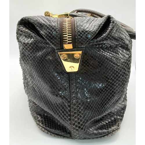 317 - A Tom Ford Python Skin Leather Handbag. Crafted in dark brown genuine python skin with a rich, natur... 