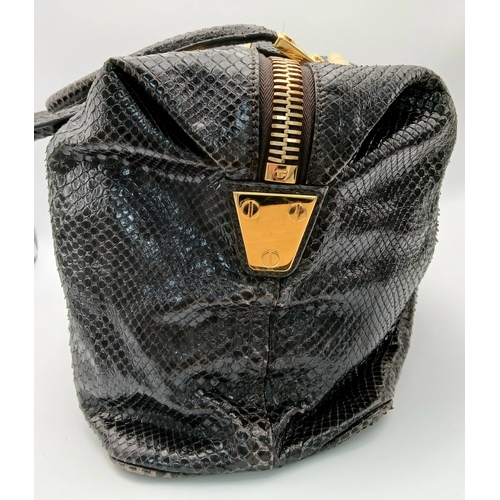317 - A Tom Ford Python Skin Leather Handbag. Crafted in dark brown genuine python skin with a rich, natur... 